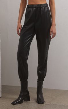 Get ready for a fun new faux leather style! The Lenora Faux Leather Jogger is made using our new Butter Touch Faux Leather fabric and features a relaxed fit and easy, pull-on design with pockets. Pair it with the Shania Rib Top for an edgy, retro look. Fabric Content: 100% Polyester Edgy Retro, Faux Leather Joggers, Night Out Looks, Faux Fur Material, Leather Joggers, Girls Joggers, Rib Top, Perfect Pant, Faux Leather Fabric