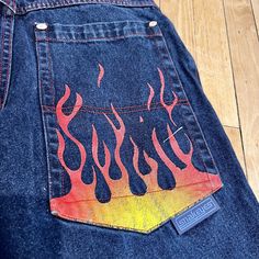 1990s Vintage SNAKE EYES Flared Wide Leg Y2K Rave FLAME Jeans Size 30". WOWIE! These pants scream "take me back to the 90s!", and I would gladly join them! Relive the glory days with this absolutely fabulous flared denim! Snake Eyes don't come around often, so add them to your collection while you can!  Era: 1990s Features: Fraying at bottom of legs, cool painted flame on bum, red stitching  Condition / Wear / Flaws: Wonderful vintage condition, no noticeable flaws; item has been washed and steamed and ready to wear  Size: Medium  Measurements laying flat: Waist- 30" Inseam- 26" Top to Bottom- 37" Fly- 12" Please take a moment to read our shipping and policies section before ordering. We have been selling vintage for over 29 years. We are careful to select only quality items in wearable co Airbrushed Jeans, Flame Jeans, Rhinestone Ideas, Paint Jeans, Custom Jeans Diy, Back To The 90s, Fashion Drawing Sketches, Flared Denim, Retro Jeans