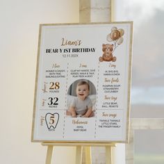 a baby's first birthday card is displayed on a easel