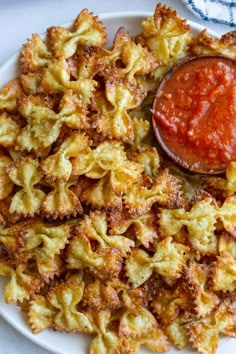 a white plate topped with pasta and sauce