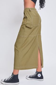 “Wow, where is your skirt from?!” Be prepared for a flood of compliments in our Women’s Cargo Maxi Skirt. This lightweight cotton-blend skirt features a relaxed fit and maxi silhouette with a slit in the back for mobility. Detailed with rectangular front patch pockets, back pockets, and one cargo pocket with a snap button tab. Complete with a front zip fly and hook and eye closure and on-trend contrast stitching throughout. Style this piece with a fitted crop top and combat boots and keep it on Cargo Outfit, Fitted Crop Top, Ymi Jeans, Black 13, Cargo Skirt, Cargo Pocket, Women Cargos, Be Prepared, Olive Color