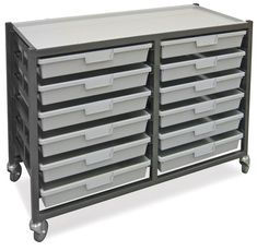 a large metal storage unit with many bins on it's sides and wheels