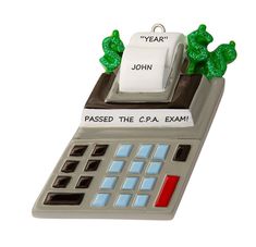 an ornament shaped like a calculator with the words year 1 and accountant written on it