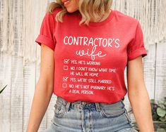 Contractor's Wife Shirt - With over 39,000 sales and more than 5,000 reviews, we have experience in providing a t-shirt you will love.Our shirt options feel soft and comfortable made from cotton (heather colors also contain polyester). - Soft t-shirts with quality shirt print - Fast customer service - We are here to help answer any questions! - Many different color and size options SIZING INFO Our unisex tees have a regular t-shirt fit. Width and length measurements for all sizes can be seen in Electrician Wife Shirts, Funny Print Cotton Shirt As A Gift, Funny Print Cotton Tops As Gift, Cotton Shirt With Funny Print As Gift, Trendy Cotton Shirt With Funny Text, Red Cotton Shirt With Funny Text, Funny Cotton Shirt Gift, Cotton Shirt As A Gift, Funny Cotton Shirt As Gift