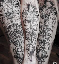 two people with tattoos on their legs, one is holding the other's leg