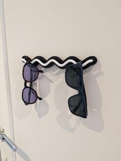 Organize your life better than before, stopping to search key and sunglasses for hours. Get your sunglass wall holder. This cute and colorful organizer that mounts to your wall and can hold up to 4 pairs of Sunglasses or mixed with keys. Choose the best color combos that fits your home and the perfect option that matches your energy!! 🔨 Installation difficulty: easy (requires a drill and a 3/16" or 5 mm drill bit--screws are included). 📐 Dimensions: Length ~20 cm x Height ~4 cm x Depth ~3 cm 🌱 Sustainability: 3D printed using Bioplastic filament--a plastic alternative made from corn. Designed by LoftedGoods and sold under license. Sunglasses Display Ideas, Best Color Combos, Diy Sunglasses Holder, Sunglass Display, Diy Sunglasses, Sunglasses Display, Wall Holder, Keychain Holder, Sunglasses Holder