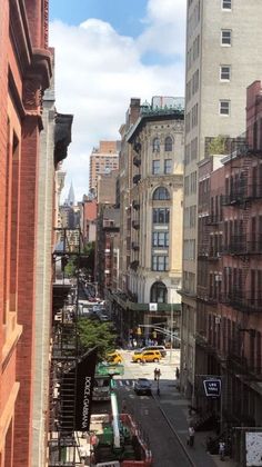 a city street filled with lots of tall buildings