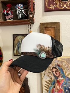 Hand branded leather strap with turquoise metal accent with feathers. Adjustable Feather Festival Jewelry, Adjustable Feather Jewelry For Festivals, Adjustable Turquoise Jewelry With Feathers, Hat Patch Ideas, Leather Outfit Ideas, Leather Hat Patch, Hat Chain, Nfr Outfits, Cowboy Hat Design