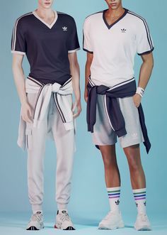 two men standing next to each other wearing adidas shorts and t - shirt shirts