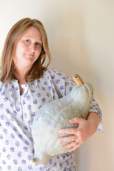 a woman holding a stuffed animal in her arms