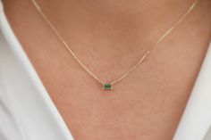 This necklace is made out of 14k solid gold with a stunning Genuine Natural green Emerald in the form of a baguette to give you a modern and mesmerizing look. The chain is adjustable in length, which makes it look lovely with any outfit. You will receive a certificate with the necklace.  Please keep into account that we use Natural Emerald, so there can be slight changes in color and cut. This makes each stone unique and one of a kind.  💎Design: Emerald Necklace 💎 Material: Solid 14k Gold and Emerald Baguette Necklace, Luxury Gold Baguette Cut Emerald Necklace, Small Emerald Necklace, 14k Gold Jewelry With Green Baguette Diamonds, Green 14k Gold Jewelry With Baguette Diamonds, Gift Fine Jewelry Emerald Necklace With Baguette Diamonds, Emerald Baguette Cut Necklace For Gift, Baguette Cut Emerald Necklace Gift, Baguette Necklace