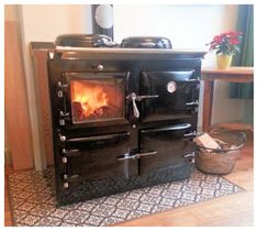 an old fashioned wood burning stove in a living room