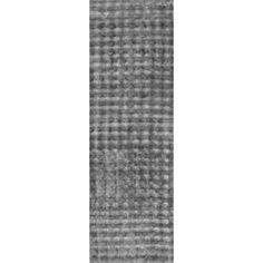 a black and white photo of a rug