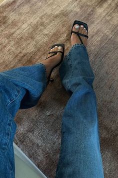 I'm loving these black strappy JLO x Revolve heels from Revolve. They're fairly comfortable as far as heels go and perfect for summer nights out. I paired them with these baggy blue jeans for an edgy cool girl look. Everything is linked on my LTK if you want to try these items out! | looks, style, heels, sandals, jeans, inspiration, wardrobe, accessories, pants Baggy Blue Jeans, Jeans Inspiration, Sivan Ayla, Perfect Heels, Latest Shoe Trends, Wardrobe Accessories, Classic Pumps, Comfortable Sneakers, Heels Sandals