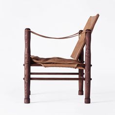 a chair made out of wood and leather