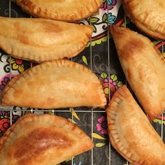 several pastries sitting on top of a cooling rack