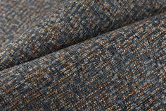 a close up view of a blue and brown tweed fabric