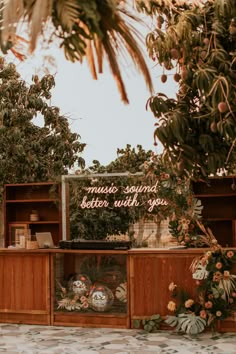 a sign that reads music sounds better with you on the side of a wooden cabinet