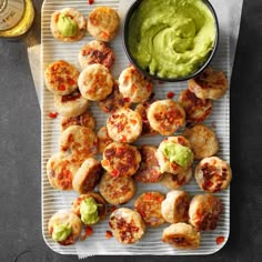 small appetizers with guacamole and salsa on a tray