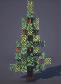 a tree made out of green leaves on a gray background