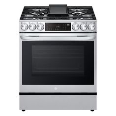 a silver stove top oven sitting on top of a white countertop next to an oven door