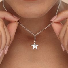 Give the gift of a lucky star with this sterling silver origami star charm necklace! This silver star charm has been crafted from recycled sterling silver and features smooth polished surfaces that reflects a high-quality shine. Inspired by the Japanese art of paper folding, known as origami, this 3d star has been designed to mimic folds of paper giving it a stunning geometric look.  All our charms attach with a clip-on clasp and are compatible with all other leading charm jewellery brands. Simp Sterling Silver Star Charm Necklace For Everyday, Silver Star Charm Necklace, Everyday Sterling Silver Star Charm Necklace, Silver Pendant Charm Necklace With Star Charm, Silver Charm Necklace With Star Charm, Silver Pendant Charm Necklaces With Star Charm, Silver Star Charm For Everyday, Elegant Silver Star Charm Necklaces, Sterling Silver Star Charm Necklace