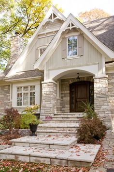 a house with stone steps leading up to the front door