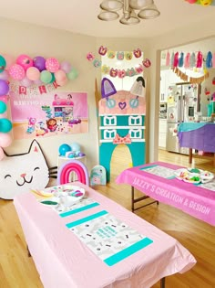 a room filled with lots of pink and blue decorations