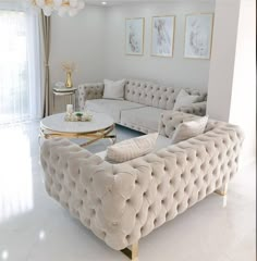 a living room filled with furniture and white walls