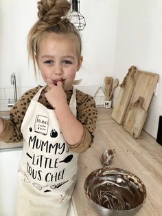 Personalised 'Mummy's Little Sous Chef' toddler apron! Inspire your little junior chef to enjoy cooking and baking with this very cool kids apron. * 100% cotton junior apron. * Velcro attachment around neck. You can also tie it to make it smaller. * Tie straps around waist. * Apron measurements shown in picture. *Please note these are off-white/beige in colour like a Tote bag. Here at Gaga Kidz we're focused on producing high-quality, on-trend, fun clothing & accessories for baby, kids & Apron Measurements, Apron Craft, Junior Chef, Apron Kids, Child Apron, Baby Apron, Toddler Apron, Fun Clothing, Craft Apron