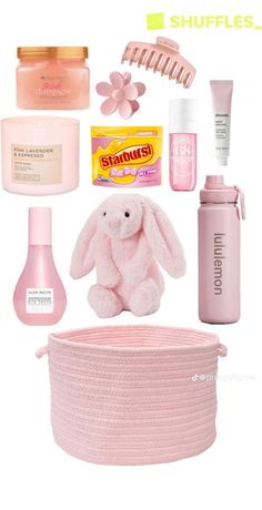 the contents of a woman's pink gift set