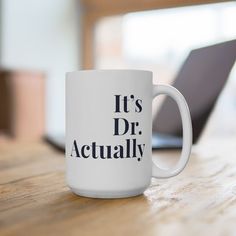 a white coffee mug with it's dr actually written in black on the side