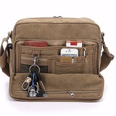 This Bag Is Sharp As Well As Versatile And Is Crafted From Durable Khaki Canvas. Durable Webbing Strap Handles And An Adjustable, Removable Padded Shoulder Strap Make It Easy To Carry Your Canvas Bag Anywhere, And It's Loaded With Organization Options With Two Exterior Flap Pockets, An Exterior Slip Pocket, Two Inside Slip Pockets, An Inside Zip Pocket And An Inside Laptop Pocket. It Gives You A Lot Of Space Which You Can Organize Your Stuff. Measures _ Bag Size: 12" W , 10" H And 4 " Deep Mens Canvas Messenger Bag, Field Bag, Mens Crossbody Bag, Tas Bahu, Canvas Messenger Bag, Canvas Crossbody Bag, Crossbody Messenger Bag, Men's Bags, Messenger Bag Men