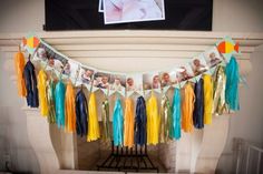 a baby's first birthday banner with photos and tassels