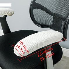 an office chair with a pillow on it's back and measurements for the seat cushion