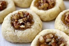 several cookies with nuts in the middle on a table