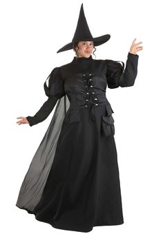 a woman in a black dress and hat with her hands out, wearing a witches costume