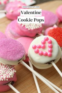 valentine's day cookie pops with sprinkles and pink frosting on them