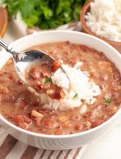 a white bowl filled with beans and rice