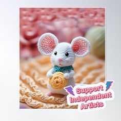 a small crocheted mouse holding a ball of yarn with the caption support independent artists