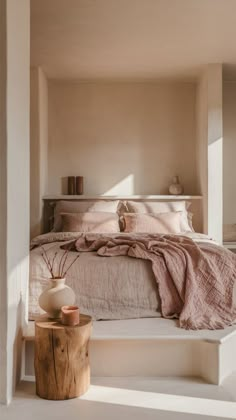 a bed sitting next to a window in a bedroom on top of a wooden platform