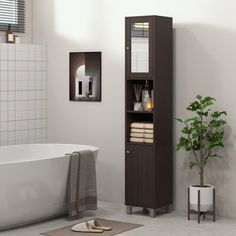 a white bath tub sitting next to a tall wooden cabinet in a bathroom under a window