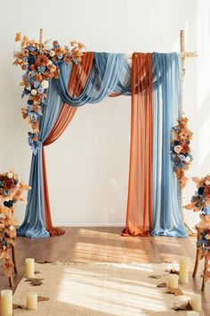 an arch decorated with flowers and candles