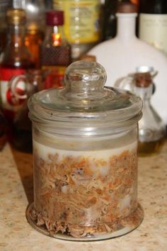 a glass jar filled with food sitting on top of a counter