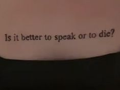 the words is it better to speak or to die? written on someone's back