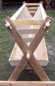 three wooden benches sitting on top of grass