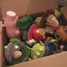 there are many toy figures in the box