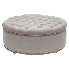 a round ottoman with buttons on the top and an inner ring at the bottom, sitting in front of a white background