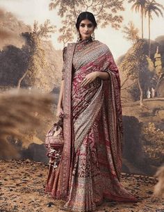 a woman in a red and white sari