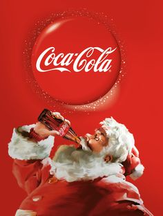 a santa clause holding a coke cola bottle in his hand and blowing it into the air